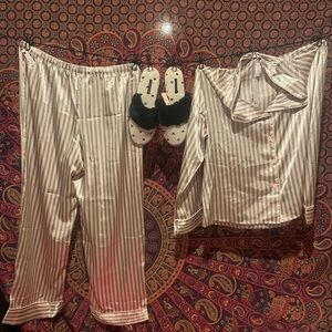 Women’s large silk pajamas with medium Victoria secrets slippers.